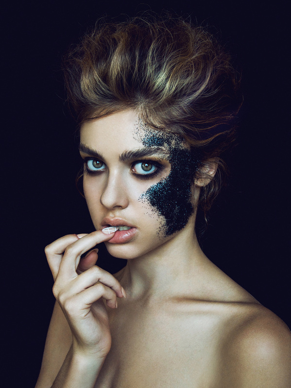 Female model with black glitter makeup by Nika Vaughan