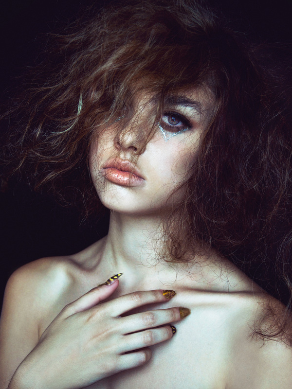 Wild hair female model with makeup by Nika Vaughan